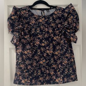 Blue floral top with puffy/ruffle sleeves